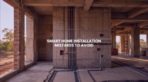 An architectural view inside a luxury villa under construction, illustrating raw brickwork and concrete conduits where correct smart home installation prevents structural rework.
